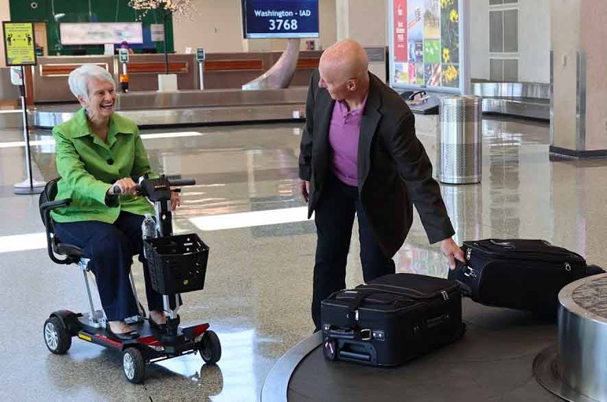 Travel-friendly mobility scooter at an airport TSA checkpoint