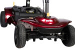 Close-up view of the front wheelbase and bumper of the Merits Roadster 4, showing its suspension system and compact, low-profile design with Merits branding.