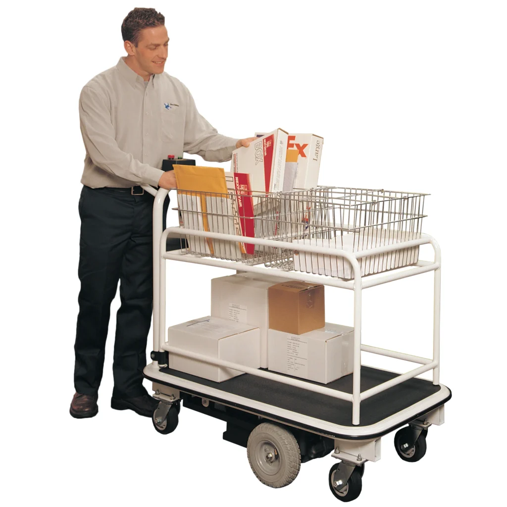 Operator moving a motorized mailroom cart loaded with parcels