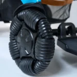 Close-up view of the unique omnidirectional front wheel of the Golden Ally Pro GP304 showing its segmented rollers for smooth multi-direction movement.