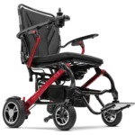 Forcemech Carbon F1 Lightweight Folding Power Wheelchair in red shown from a lower angle highlighting the frame wheel...