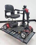 Pride Go Go travel scooter strapped onto the Model 210 platform