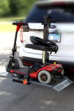 Travel scooter loaded on the Model 117 behind an SUV